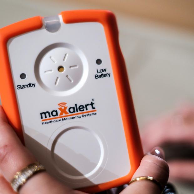 A Maxalert monitor being checked by hand